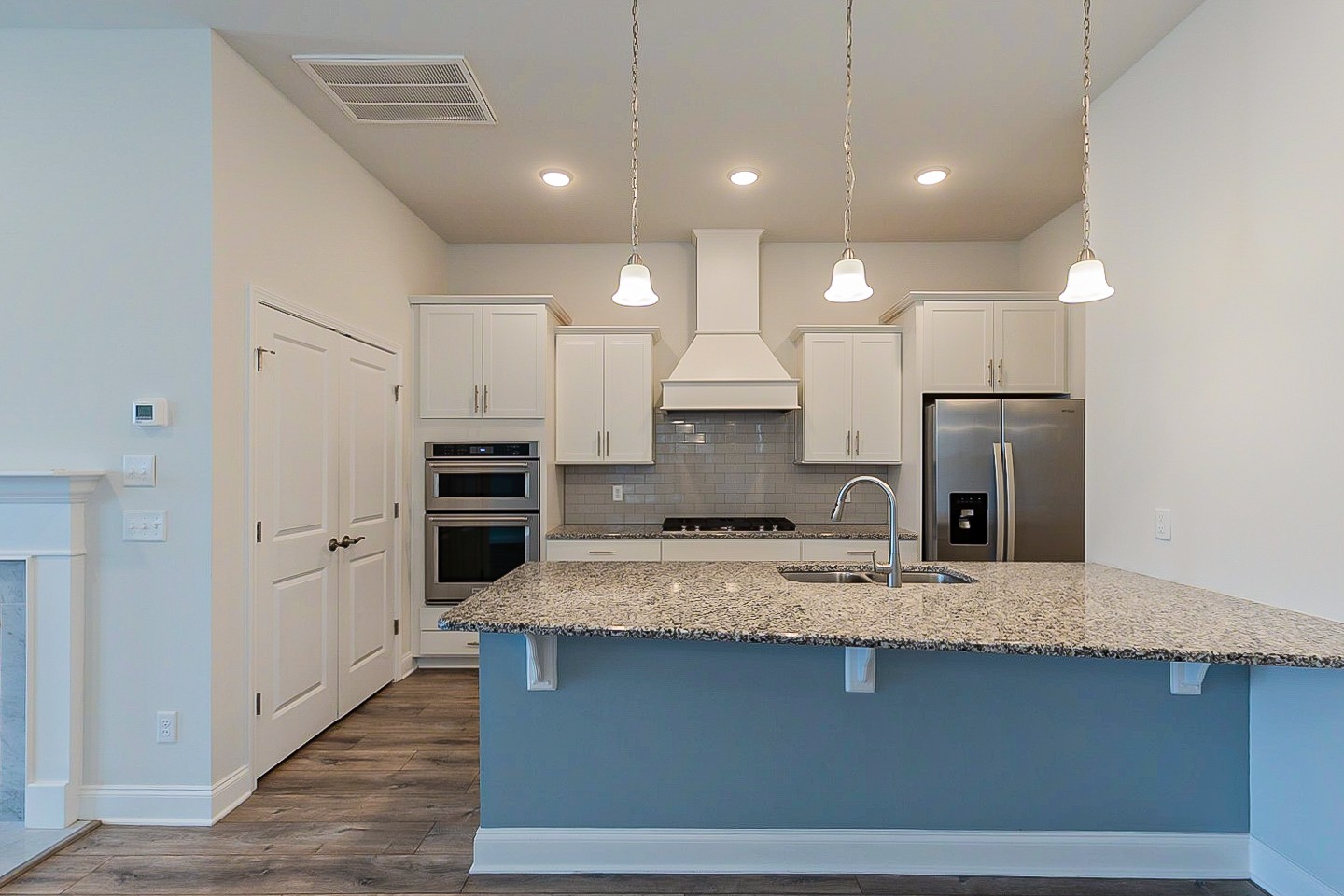 1001 Lonergan Circle Spring Hill, TN 37174 - Photo 2 of 38 a large kitchen with a center island and stainless steel appliances