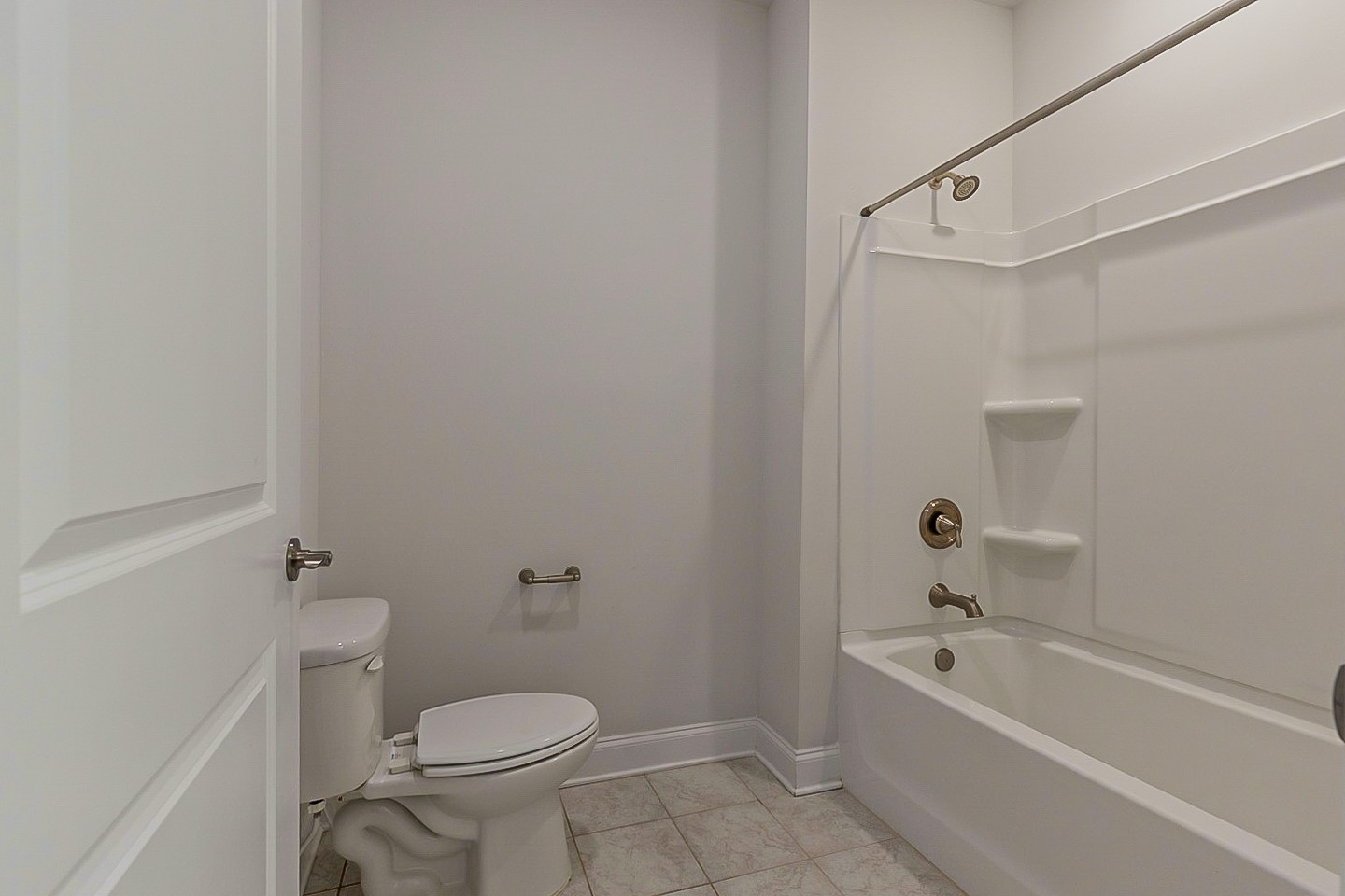 1001 Lonergan Circle Spring Hill, TN 37174 - Photo 33 of 38 a white toilet sitting next to a bath tub
