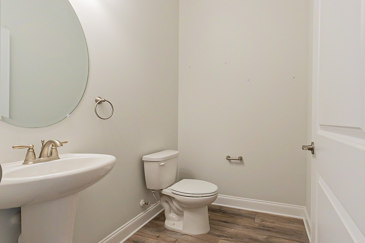 1001 Lonergan Circle Spring Hill, TN 37174 - Photo 35 of 38 a bathroom with a toilet sink and mirror