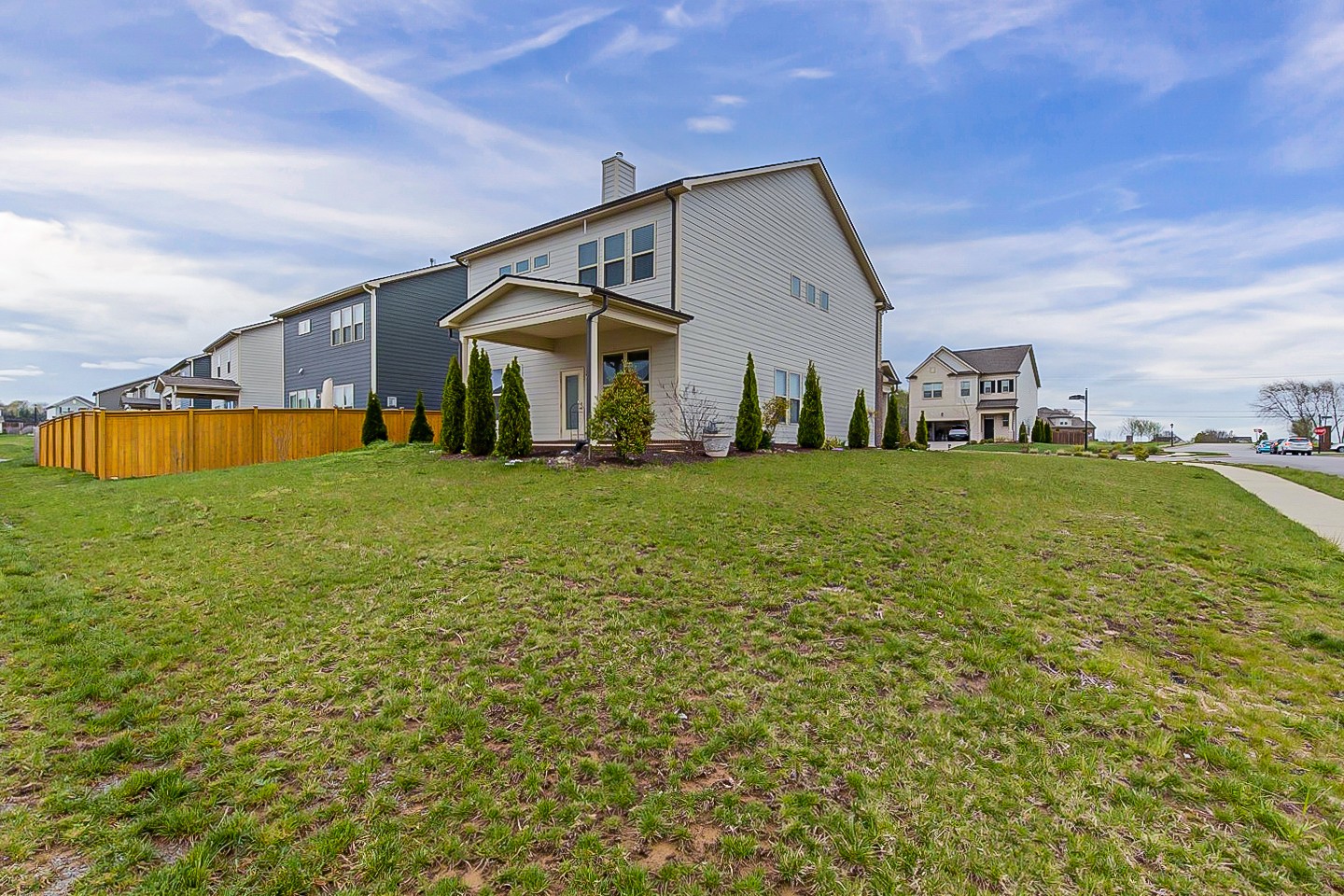 1001 Lonergan Circle Spring Hill, TN 37174 - Photo 37 of 38 a view of a house with a big yard and a large tree