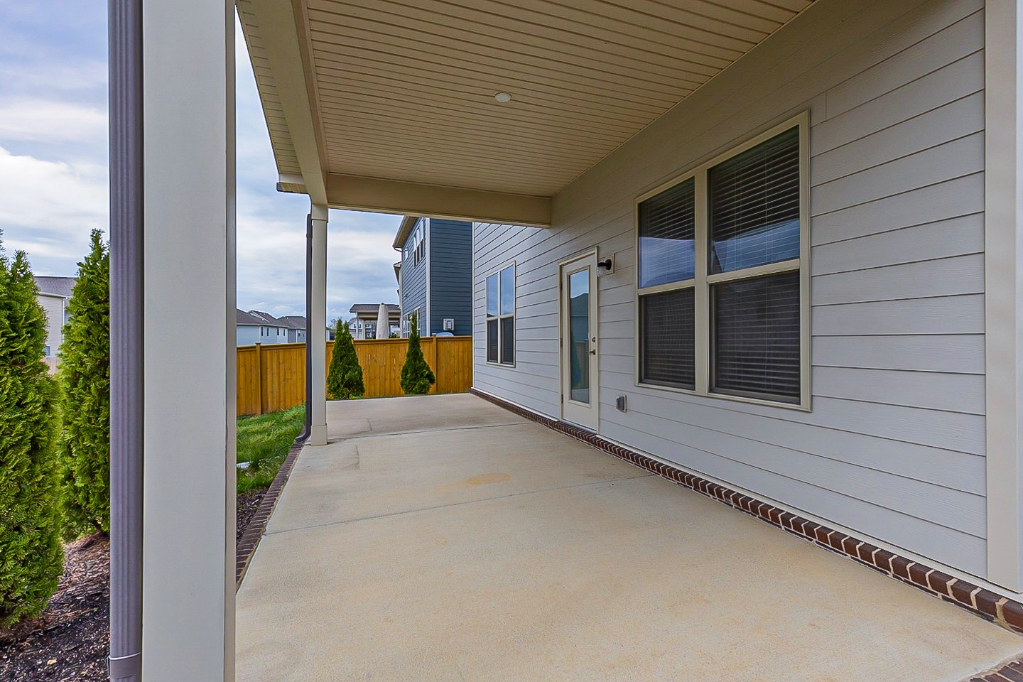 1001 Lonergan Circle Spring Hill, TN 37174 - Photo 38 of 38 a view of a patio with wooden door