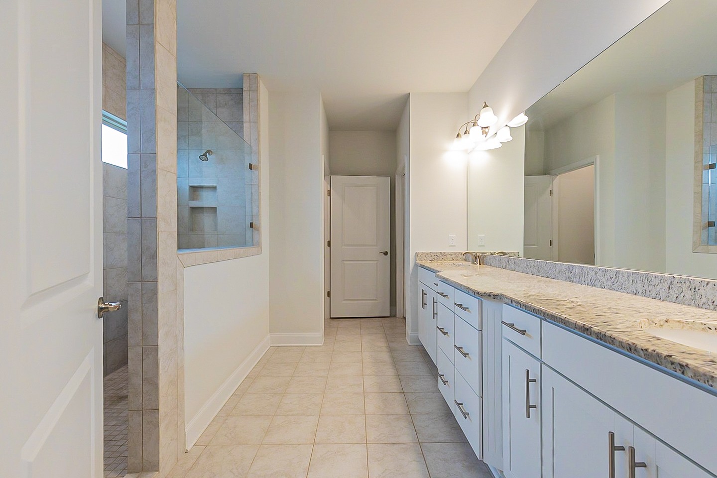 1001 Lonergan Circle Spring Hill, TN 37174 - Photo 4 of 38 a spacious bathroom with a granite countertop sink mirror and a