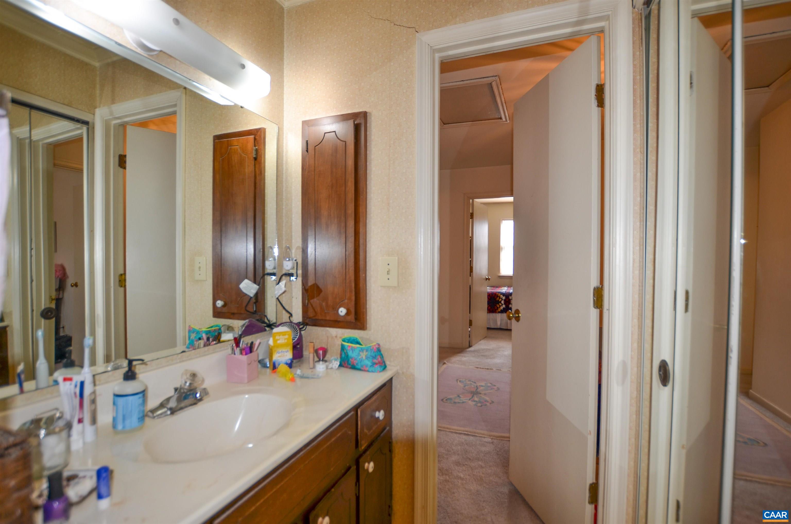 1594 Cool Spring Road Charlottesville, VA 22901 - Photo 21 of 26 a bathroom with a sink vanity and a mirror