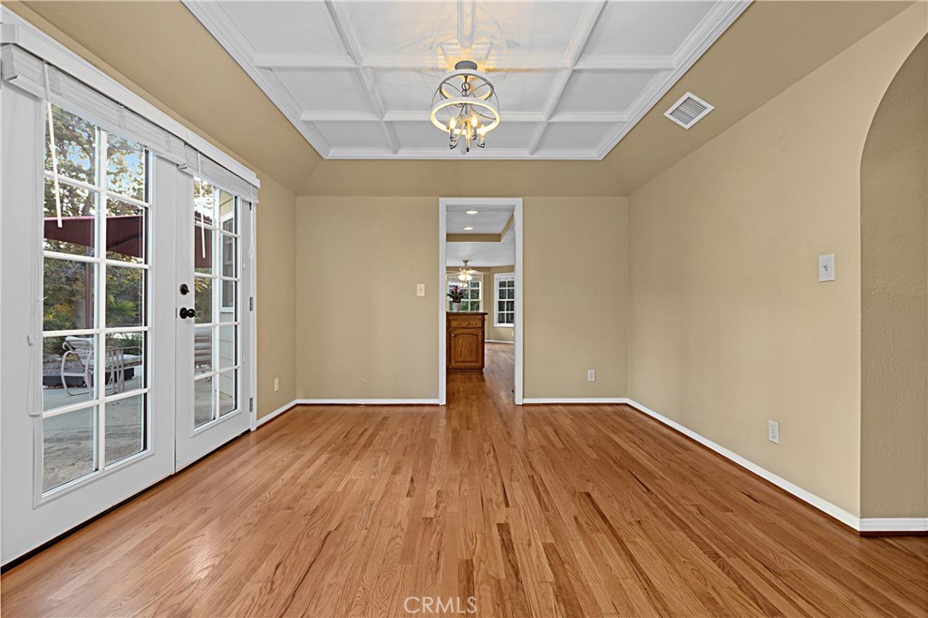 1011 Farrand Court Fallbrook, CA 92028 - Photo 16 of 49 a view of an empty room with wooden floor and a window
