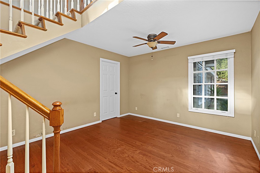 1011 Farrand Court Fallbrook, CA 92028 - Photo 17 of 49 a view of empty room with wooden floor and fan