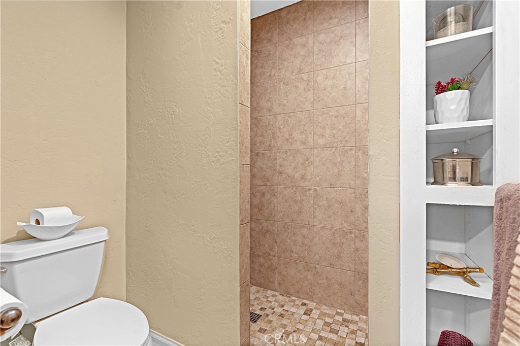 1011 Farrand Court Fallbrook, CA 92028 - Photo 18 of 49 a bathroom with a toilet and a shower