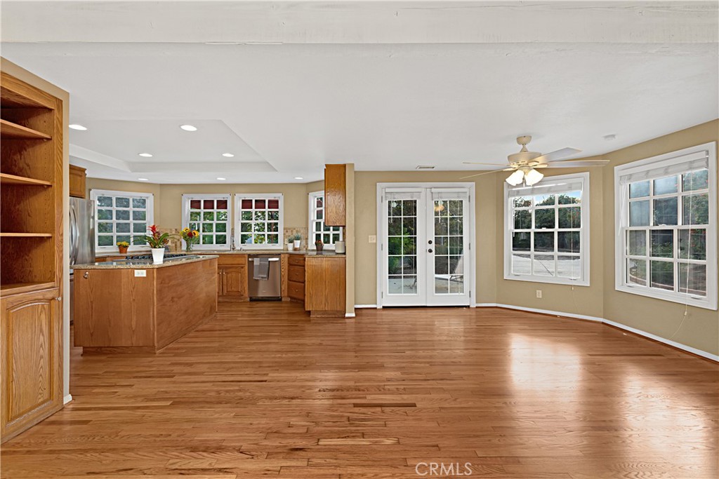1011 Farrand Court Fallbrook, CA 92028 - Photo 19 of 49 a view of an empty room with wooden floor and a window