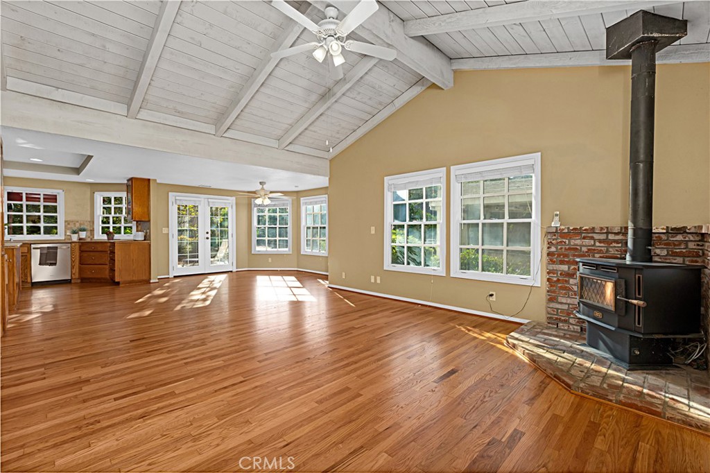 1011 Farrand Court Fallbrook, CA 92028 - Photo 27 of 49 a view of empty room with wooden floor and windows