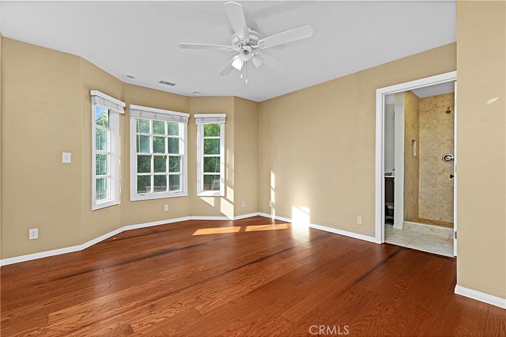 1011 Farrand Court Fallbrook, CA 92028 - Photo 29 of 49 an empty room with wooden floor and windows