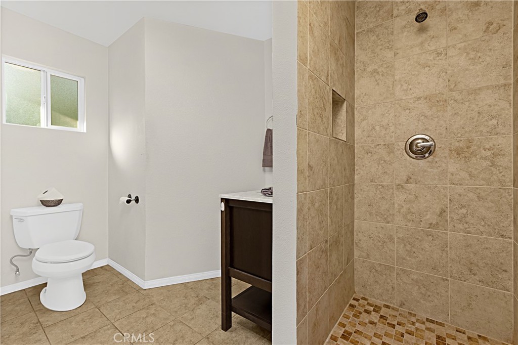 1011 Farrand Court Fallbrook, CA 92028 - Photo 30 of 49 a bathroom with a toilet and a shower