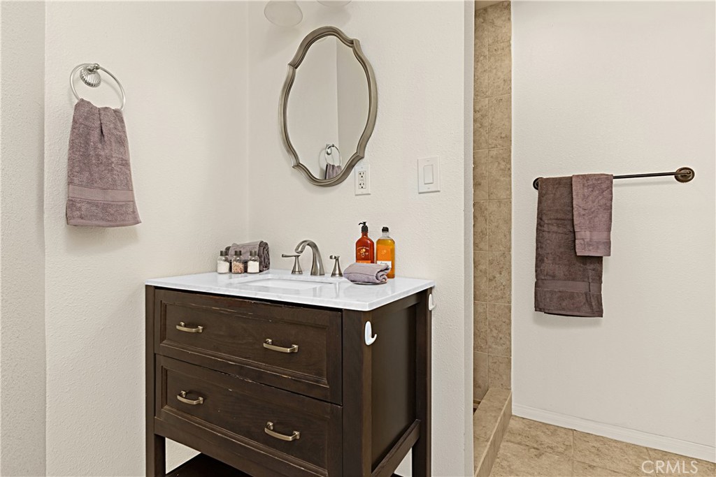 1011 Farrand Court Fallbrook, CA 92028 - Photo 31 of 49 a utility room with a sink and a mirror
