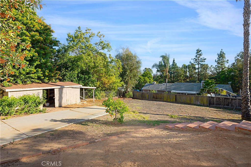 1011 Farrand Court Fallbrook, CA 92028 - Photo 37 of 49 a front view of a house with a yard and trees