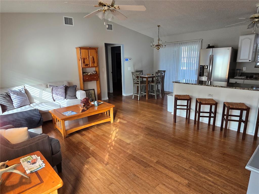 24521 Alligator Road Astor, FL 32102 - Photo 4 of 51 a living room with furniture and wooden floor