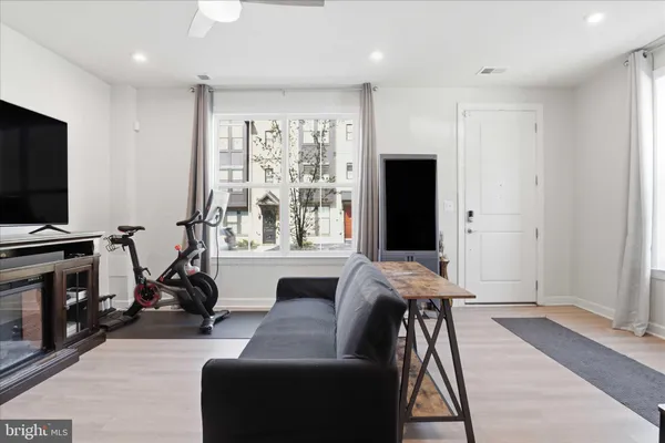 a view of a livingroom with furniture and a flat screen tv