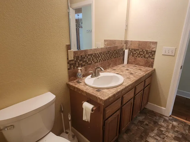a bathroom with a sink and a mirror
