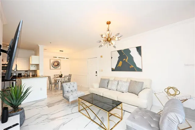 a view of living room with furniture and a flat screen tv