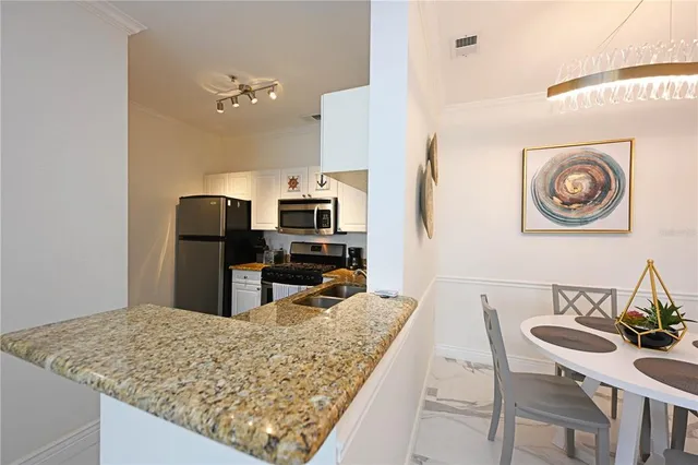 a view of a balcony with furniture