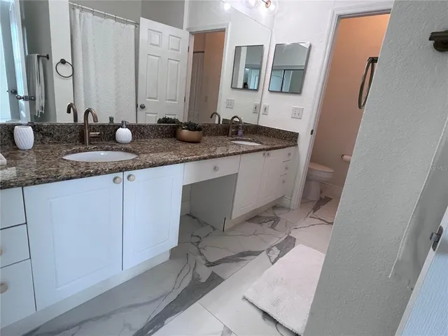 a bathroom with a tub and a sink