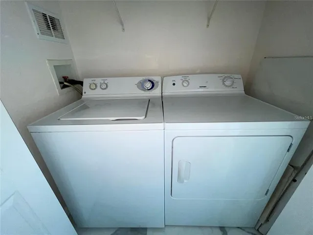 a view of a swimming pool with lounge chair