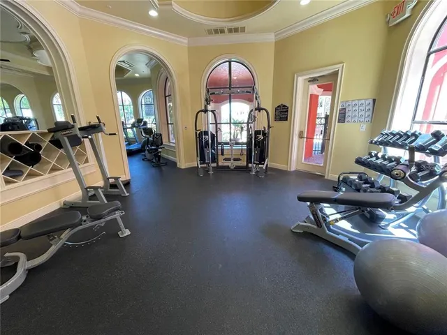 a living room with couches chairs and couches with wooden floor