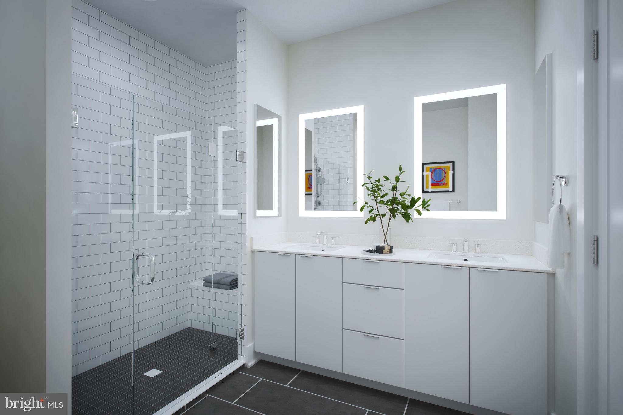 61 Lower Service Road Northwest, Unit POWELL 820 Washington, DC 20422 - Photo 7 of 12 a bathroom with a shower sink and mirror