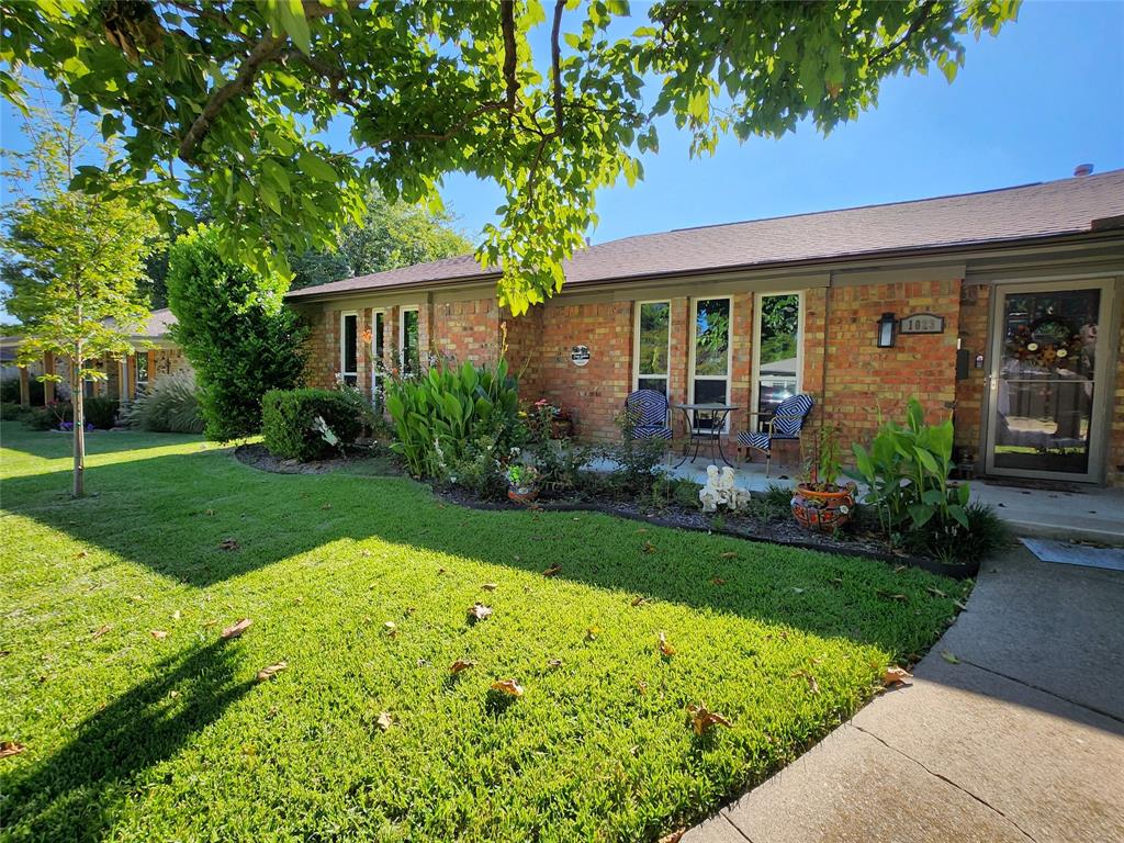 1023 Ridgefield Drive Plano, TX 75075 - Photo 3 of 39 a view of a house with garden and yard