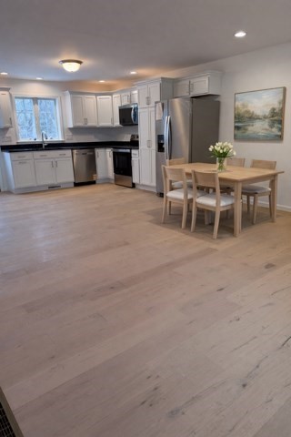 531 Foundry Street, Unit D Easton, MA 02356 - Photo 4 of 16 a large white kitchen with a large window