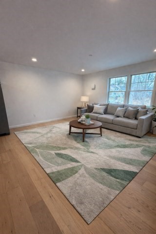 531 Foundry Street, Unit D Easton, MA 02356 - Photo 7 of 16 a living room with furniture and a couch