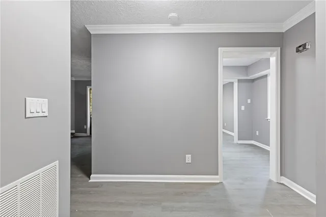 an empty room with closet and a bathroom