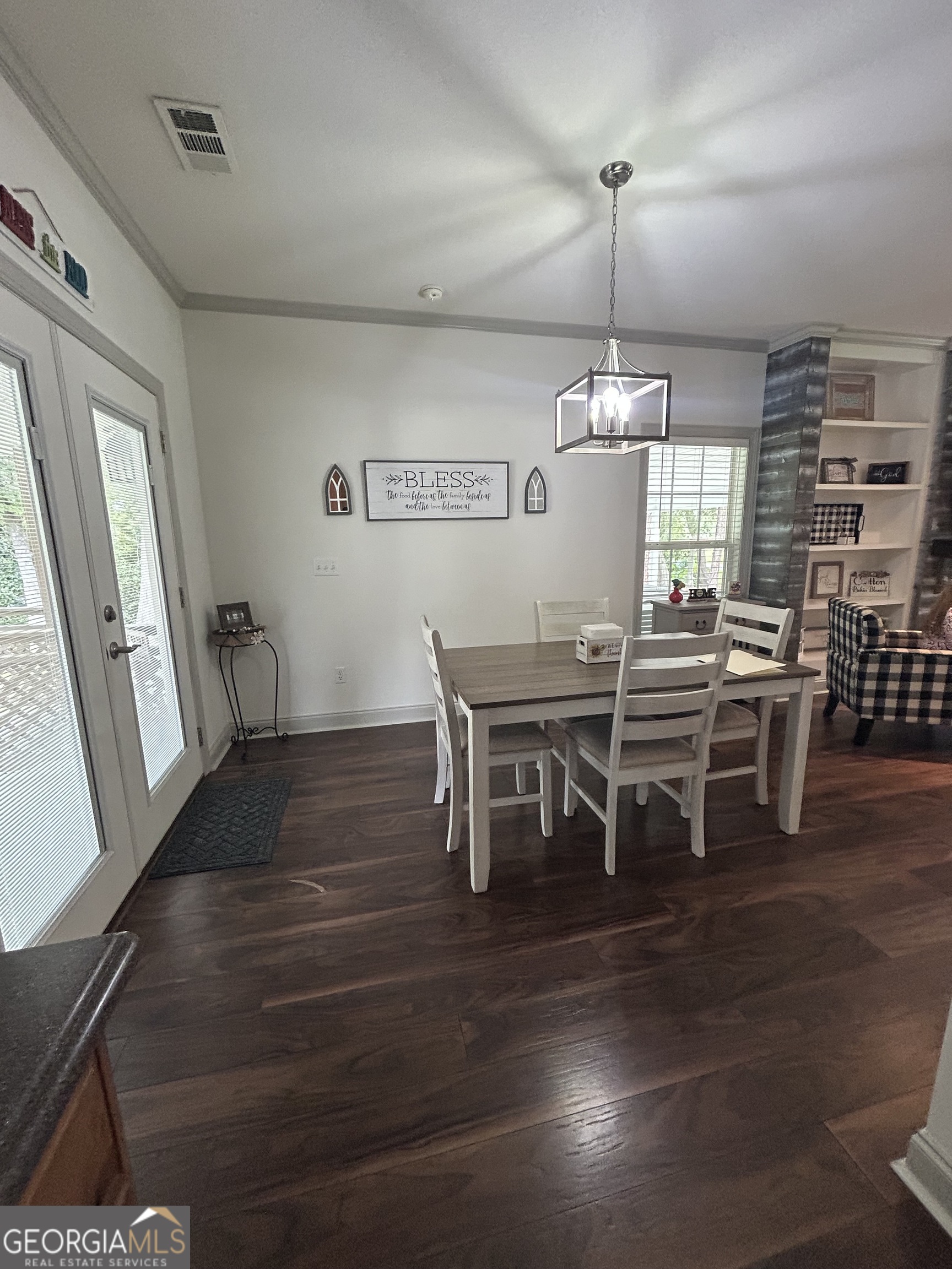 94 24th Avenue Eastman, GA 31023 - Photo 16 of 27 a view of a dining room with furniture window and wooden floor
