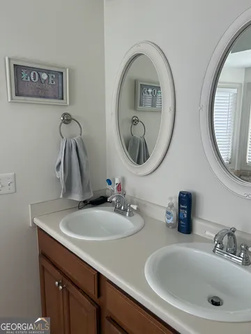 a bathroom with a sink and a mirror