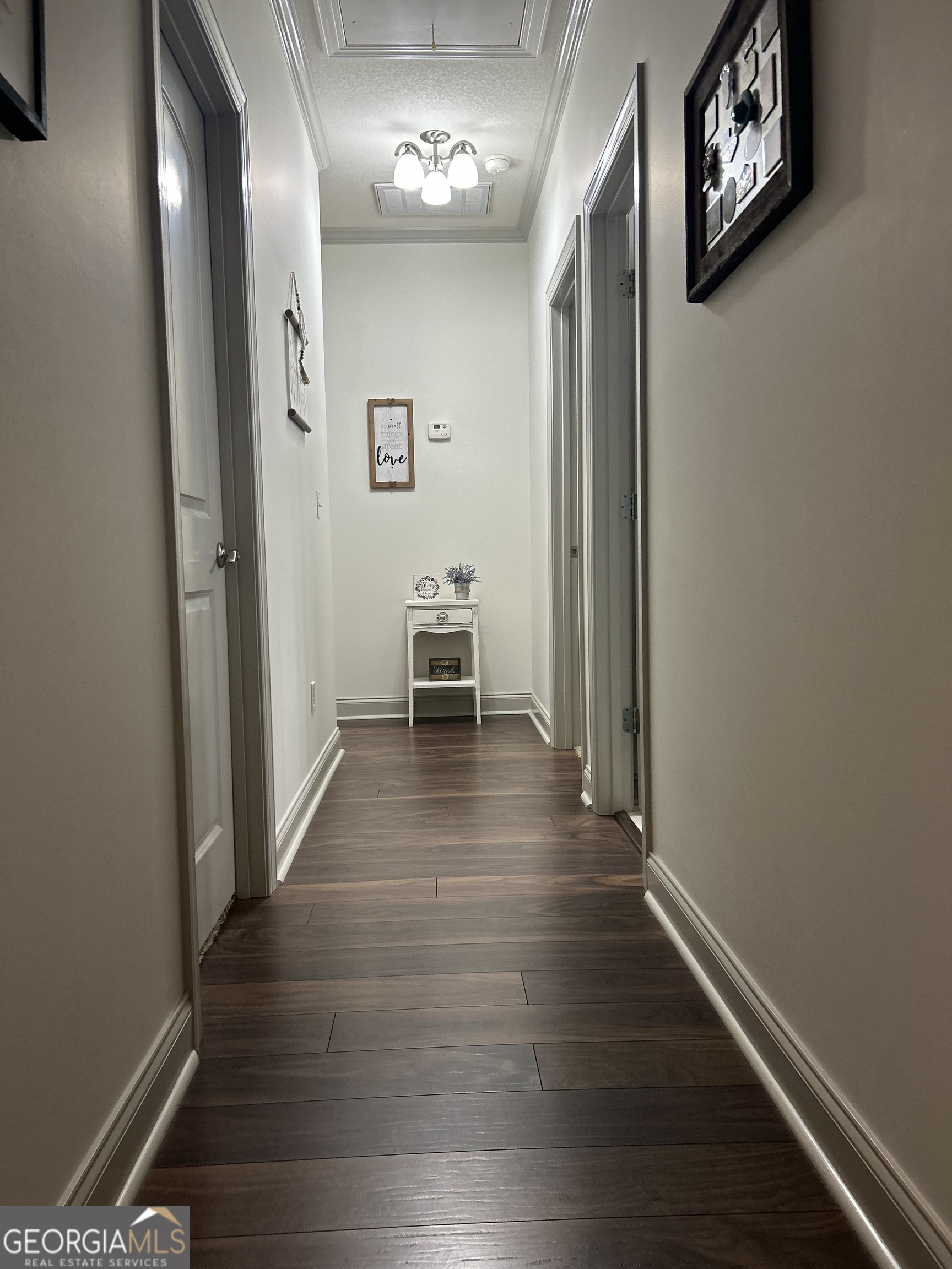 94 24th Avenue Eastman, GA 31023 - Photo 26 of 27 a view of a hallway with wooden floor and a window