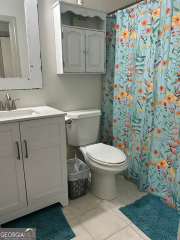 a bathroom with a toilet and a sink