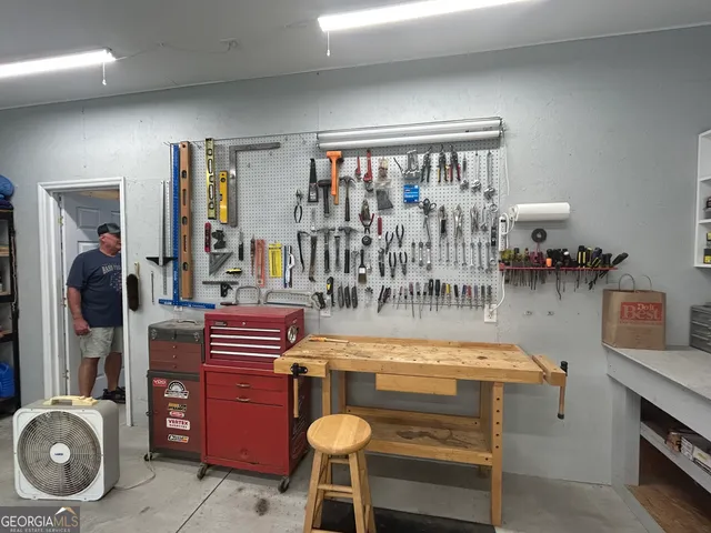 a dining room with furniture and chandelier
