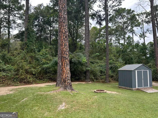 a backyard of a house with lots of green space