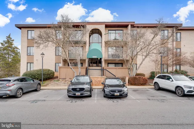 a view of a car parked in front of a house