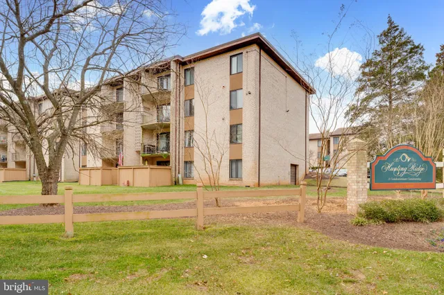 a front view of a building with a yard