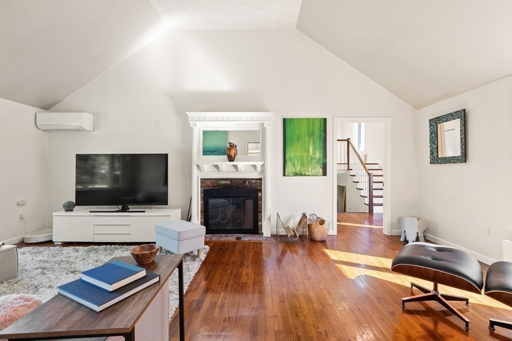 105 Georgetown Road Boxford, MA 01921 - Photo 19 of 42 a living room with furniture and a flat screen tv