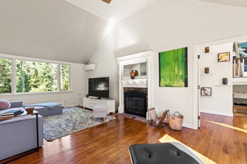 105 Georgetown Road Boxford, MA 01921 - Photo 20 of 42 a living room with furniture and a flat screen tv