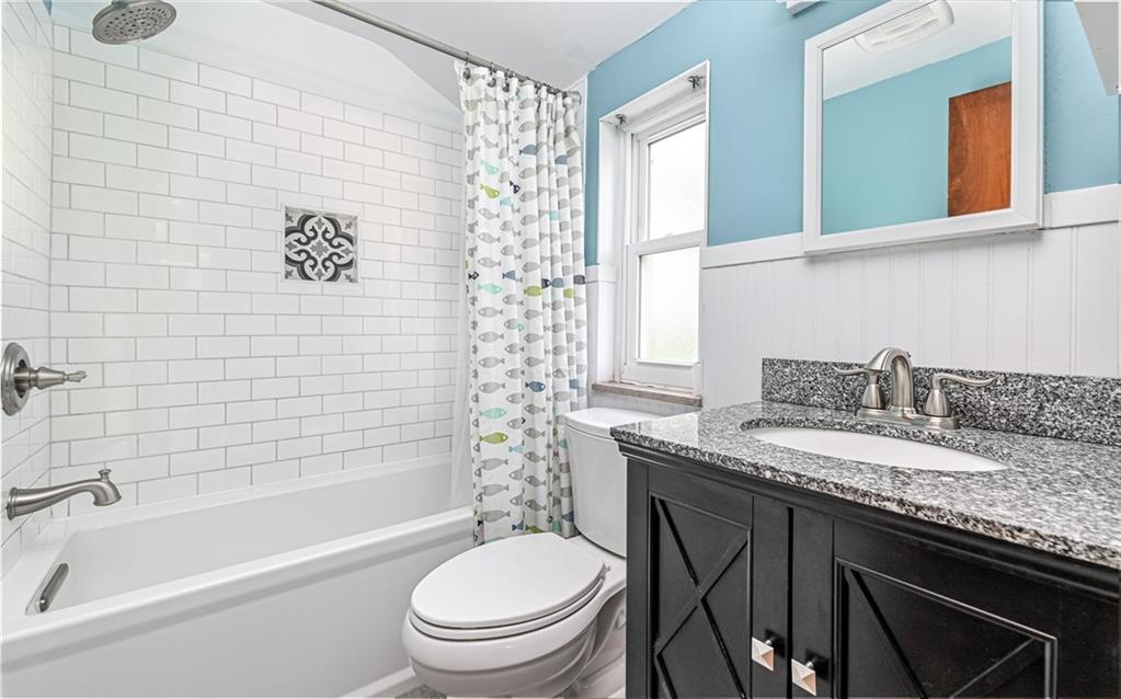 2349 Rose Garden Road Pittsburgh, PA 15220 - Photo 11 of 22 Second level full bathroom with ceramic tiled shower wall, granite top vanity and bead board walls.
