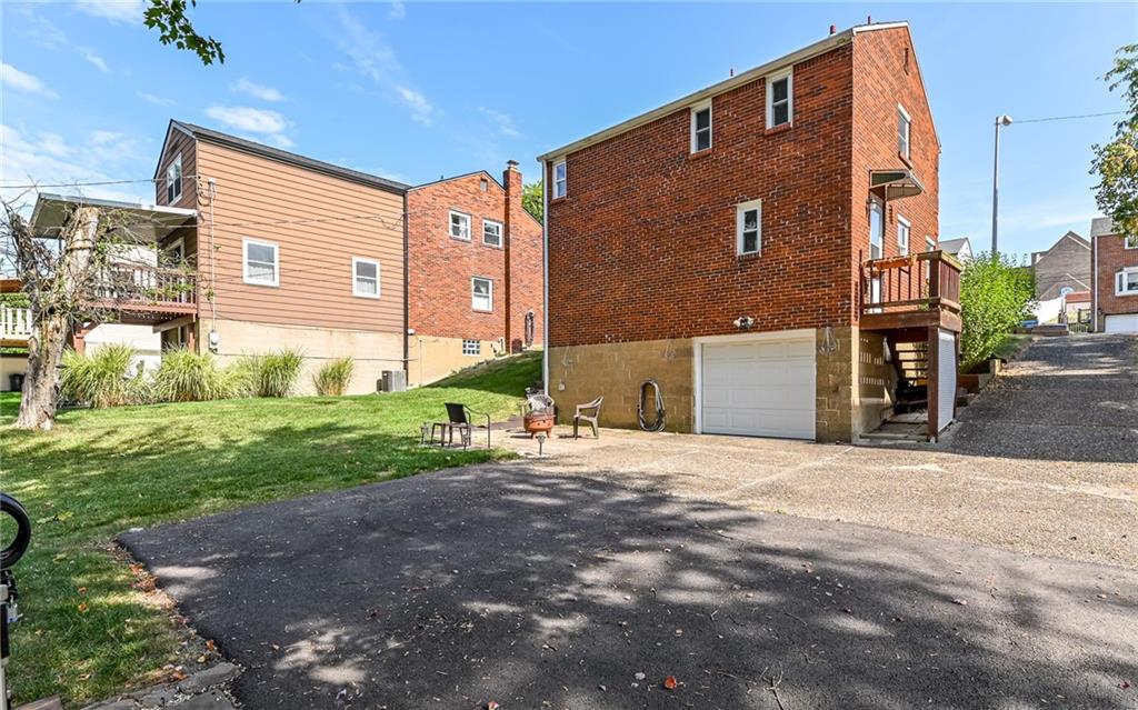 2349 Rose Garden Road Pittsburgh, PA 15220 - Photo 17 of 22 Long driveway with plenty of room for parking and one car garage updated with steel insulated door with keyless entry.