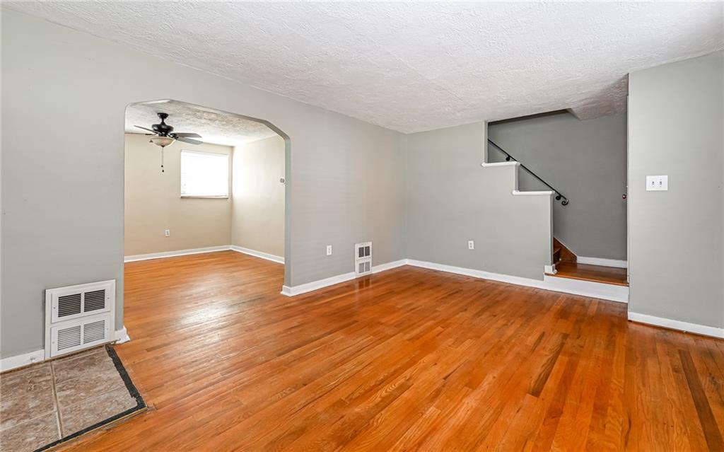2349 Rose Garden Road Pittsburgh, PA 15220 - Photo 4 of 22 Warm and inviting living room. Original hardwood flooring has been exposed throughout the home.