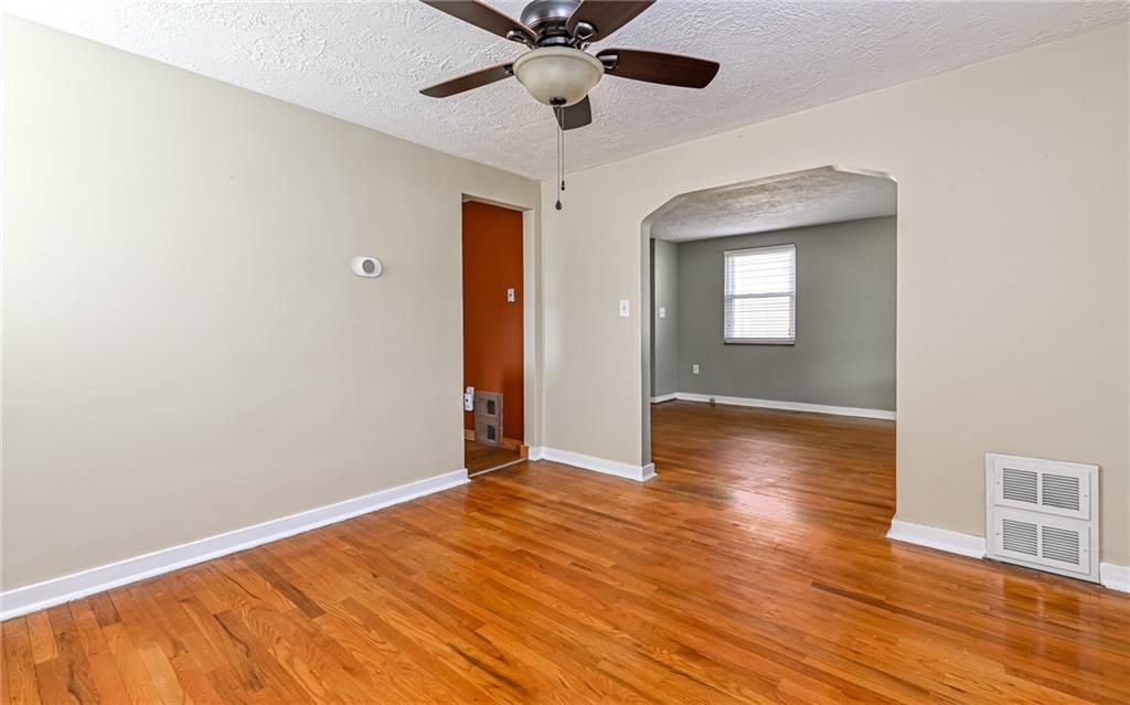 2349 Rose Garden Road Pittsburgh, PA 15220 - Photo 5 of 22 Dining room is open to the living room and kitchen and features ceiling fan with overhead lighting.