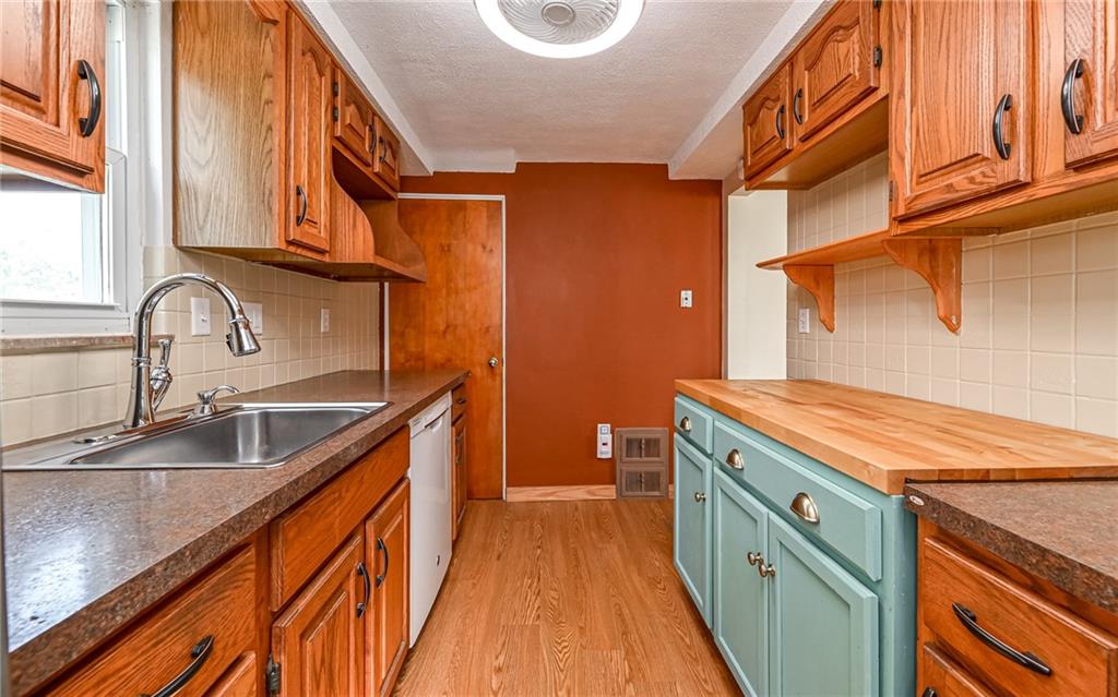 2349 Rose Garden Road Pittsburgh, PA 15220 - Photo 9 of 22 Generous storage and ample counters make meal prep a breeze.