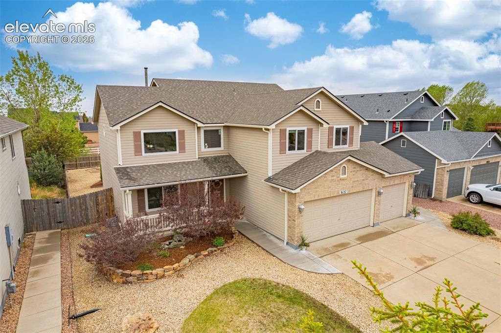 9127 Oakmont Road Peyton, CO 80831 - Photo 46 of 49 a front view of a house with a yard