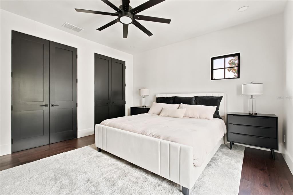 9725 Chestnut Ridge Drive Windermere, FL 34786 - Photo 38 of 64 a bedroom with a bed and a painting on the wall