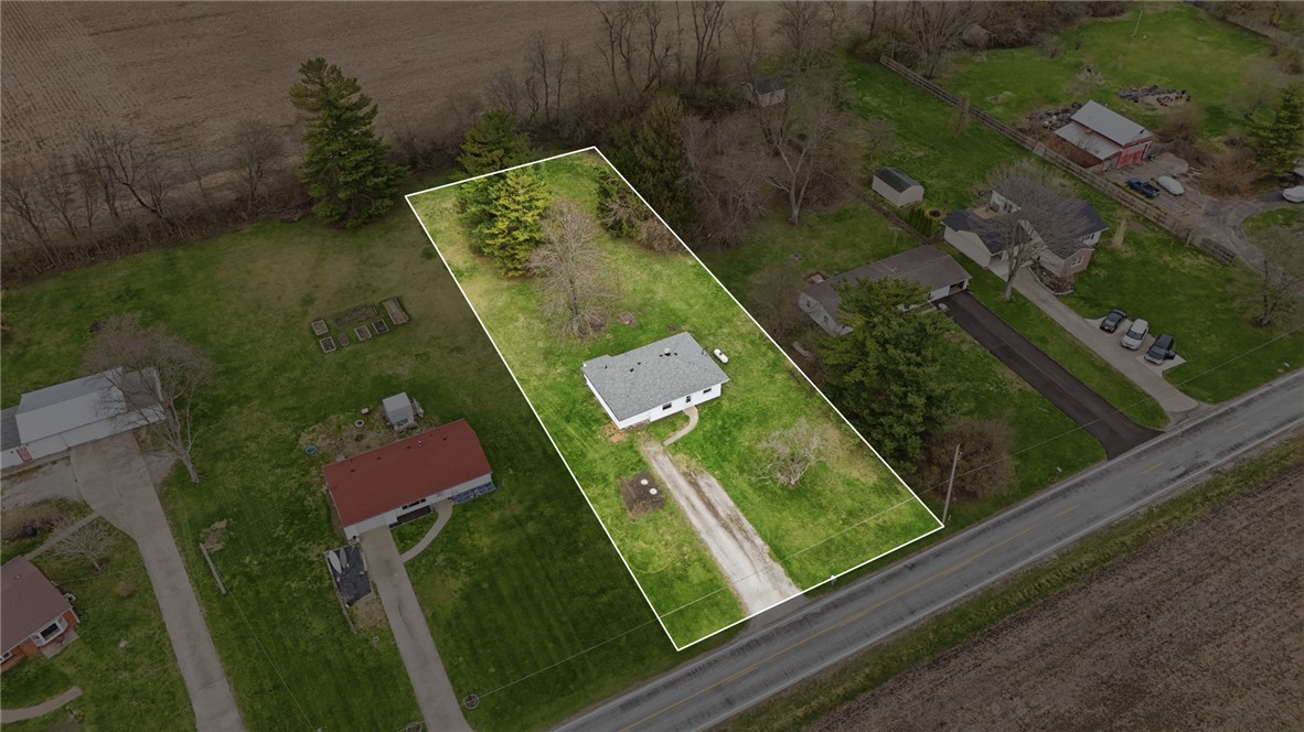 1166 West Sparrow Road Springfield, OH 45502 - Photo 2 of 40 An aerial view captures a home nestled on a spacious lot, offering ample room for outdoor activities.