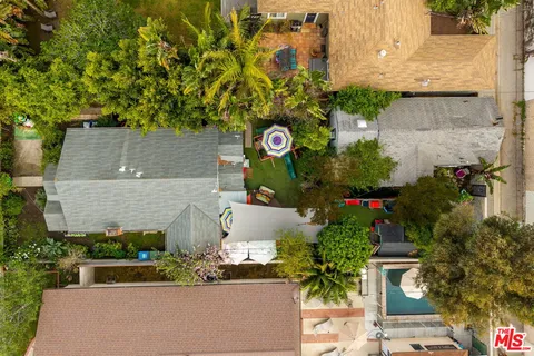 aerial view of a house with a yard and garden