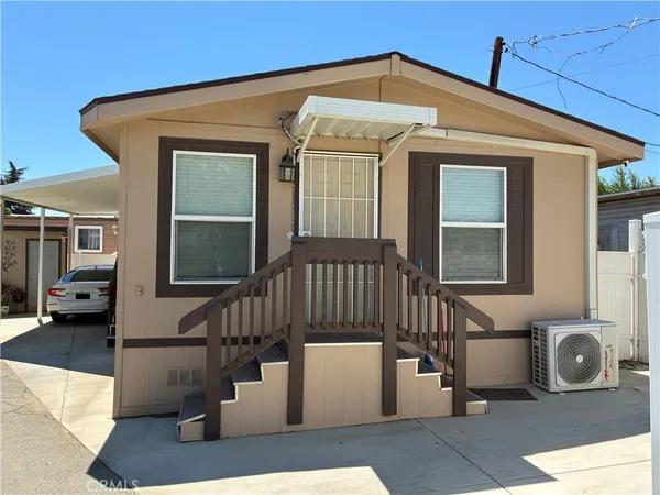a front view of a house with garage