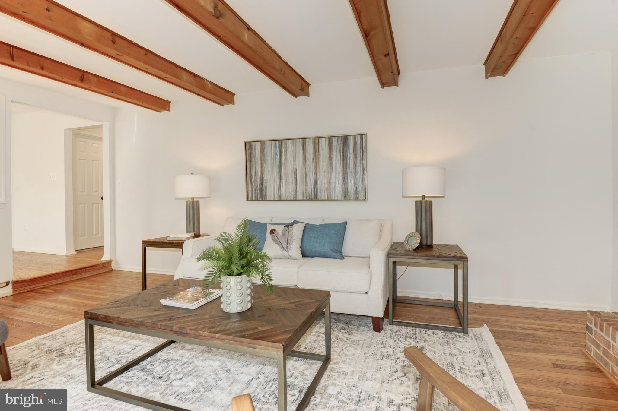 10809 Cross School Road Reston, VA 20191 - Photo 26 of 60 a living room with furniture and a wooden floor